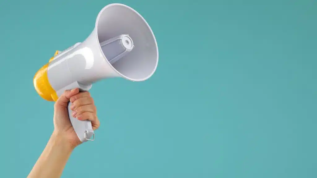 Woman holding megaphone speaker