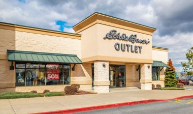 General view of the facade, logo and entrance at an Eddie Bauer Outlet store.