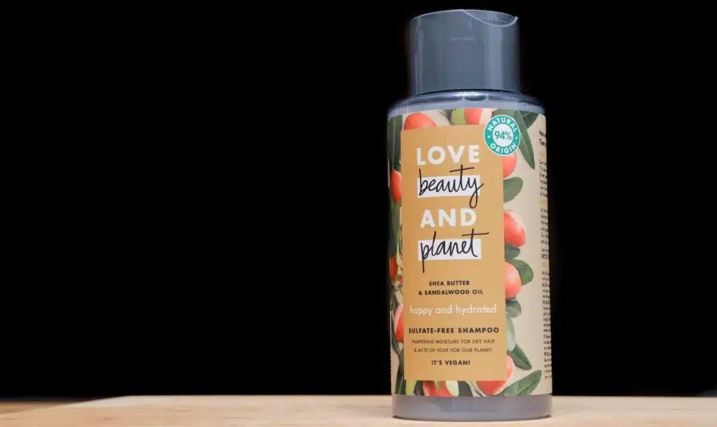 Illustrative Editorial: Love beauty and planet shampoo bottle, an ecological Unilever brand, on a dark and black background. Isolated.