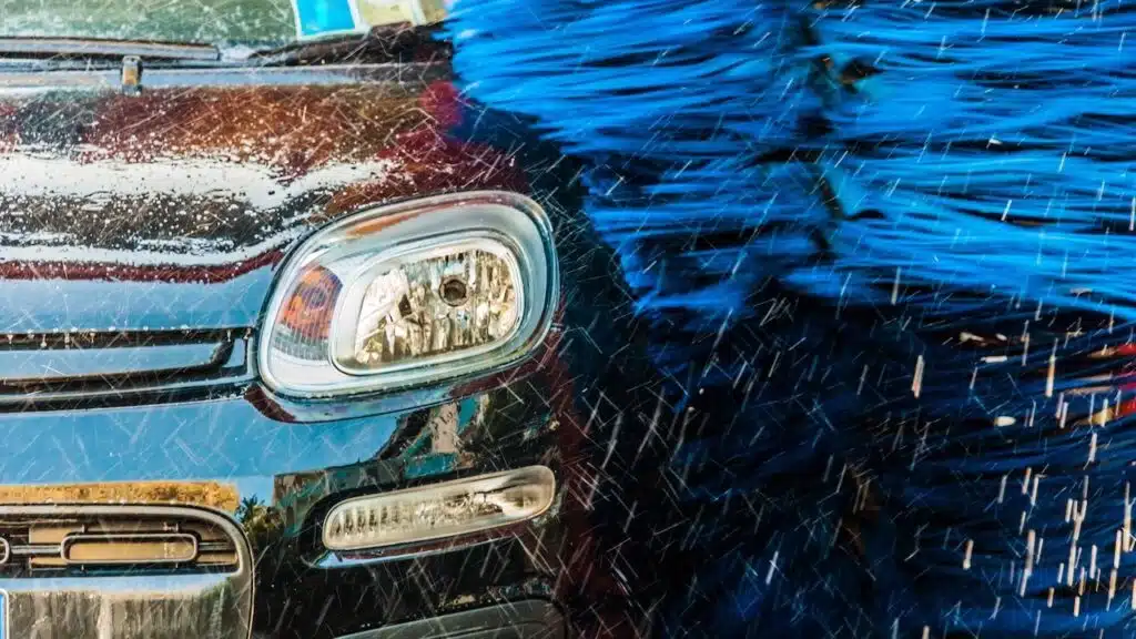 Car going through an automated car wash machine.