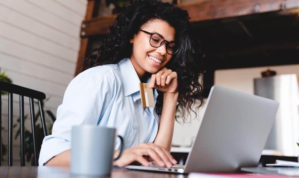woman buying online on laptop at home.