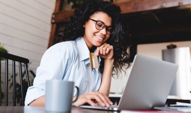woman buying online on laptop at home.