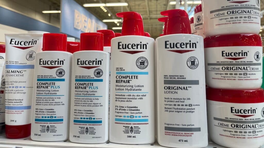 Various Eucerin skin care products on display on a store shelf.