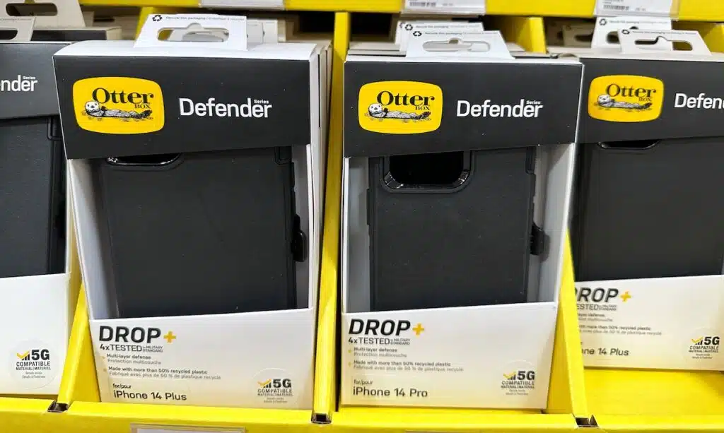 Otterbox Defender Series black iPhone 14 model phone cases for sale at a Sams Club