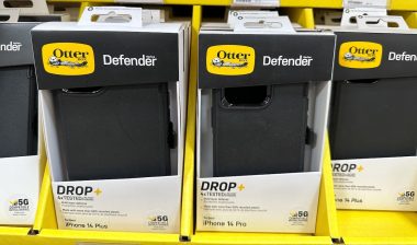 Otterbox Defender Series black iPhone 14 model phone cases for sale at a Sams Club