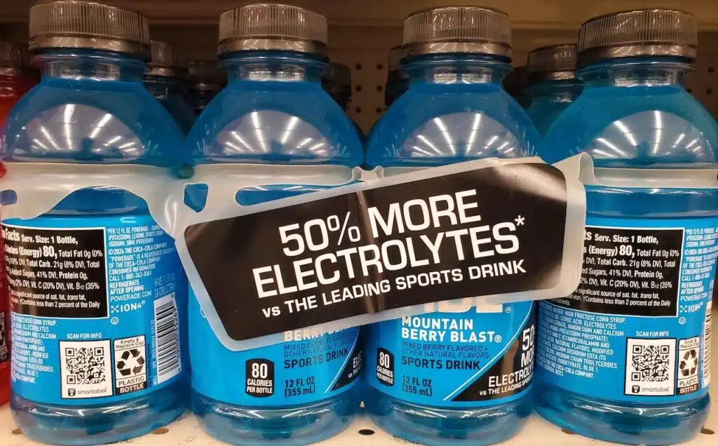 The blue Powerade sports drink electrolytes enchanced Mountain Berry Blast flavor