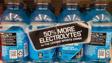 The blue Powerade sports drink electrolytes enchanced Mountain Berry Blast flavor