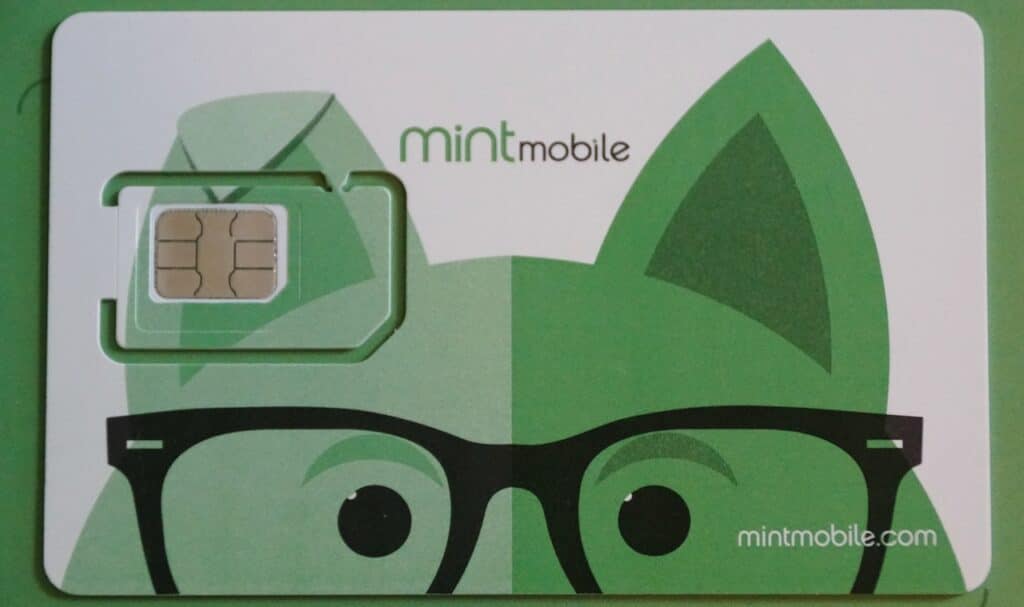Mint Mobile SIM card, featuring a playful cartoon fox design in green with black glasses.