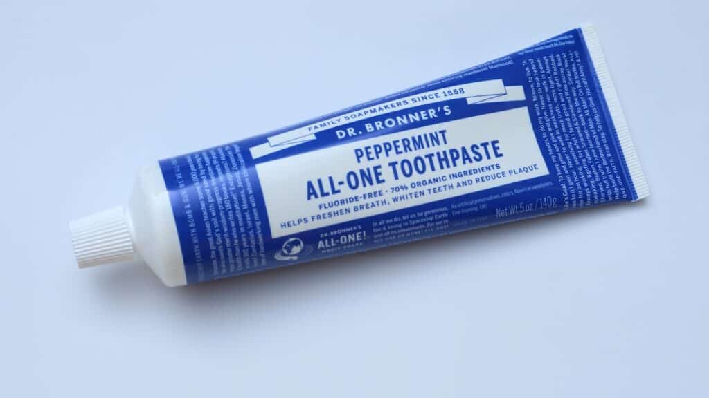 Peppermint Toothpaste brand DR. Bronner's All One, fluoride free, 70% organic ingredients.