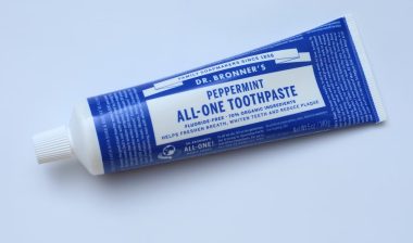 Peppermint Toothpaste brand DR. Bronner's All One, fluoride free, 70% organic ingredients.
