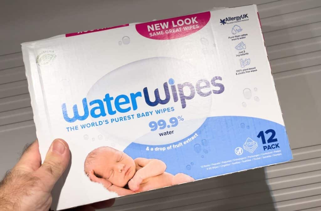 hand holding package with WaterWipes the world's purest baby wipes.