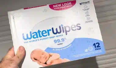 hand holding package with WaterWipes the world's purest baby wipes.