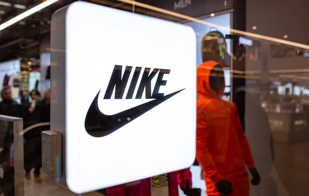 Nike neon store sign in shop window.