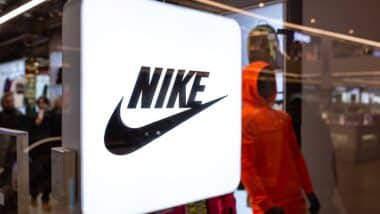 Nike neon store sign in shop window.