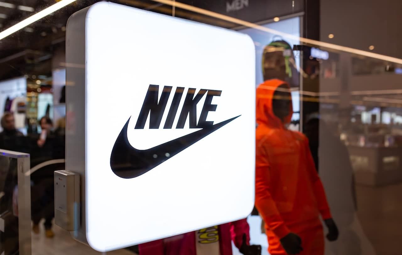 Nike neon store sign in shop window.
