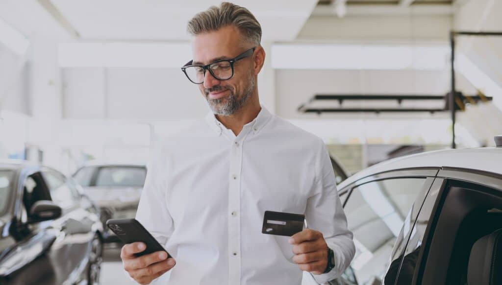 Man on phone with credit card service