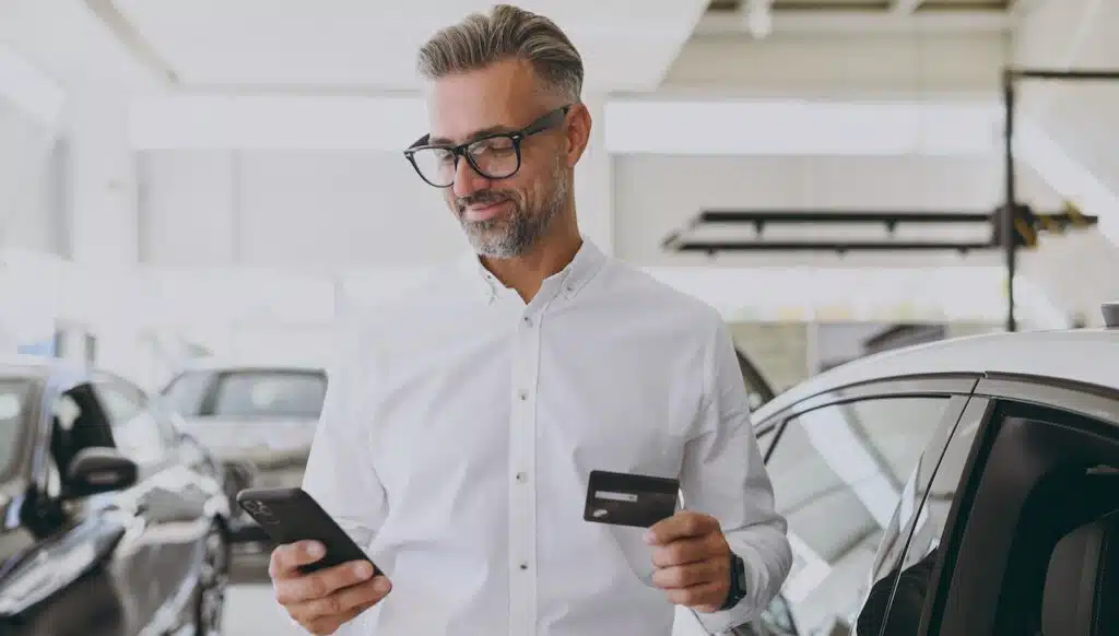 Man on phone with credit card service