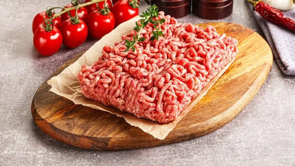 Raw minced beef uncooked meat over board.