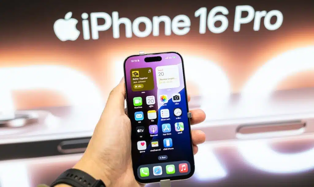 Apple launch new smartphone iPhone 16 Pro displayed in a Store. Hand holding iPhone 16 Pro.