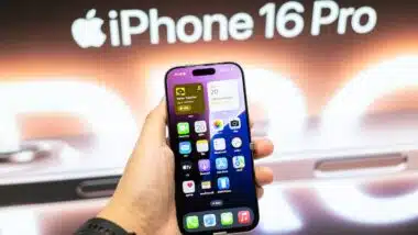 Apple launch new smartphone iPhone 16 Pro displayed in a Store. Hand holding iPhone 16 Pro.