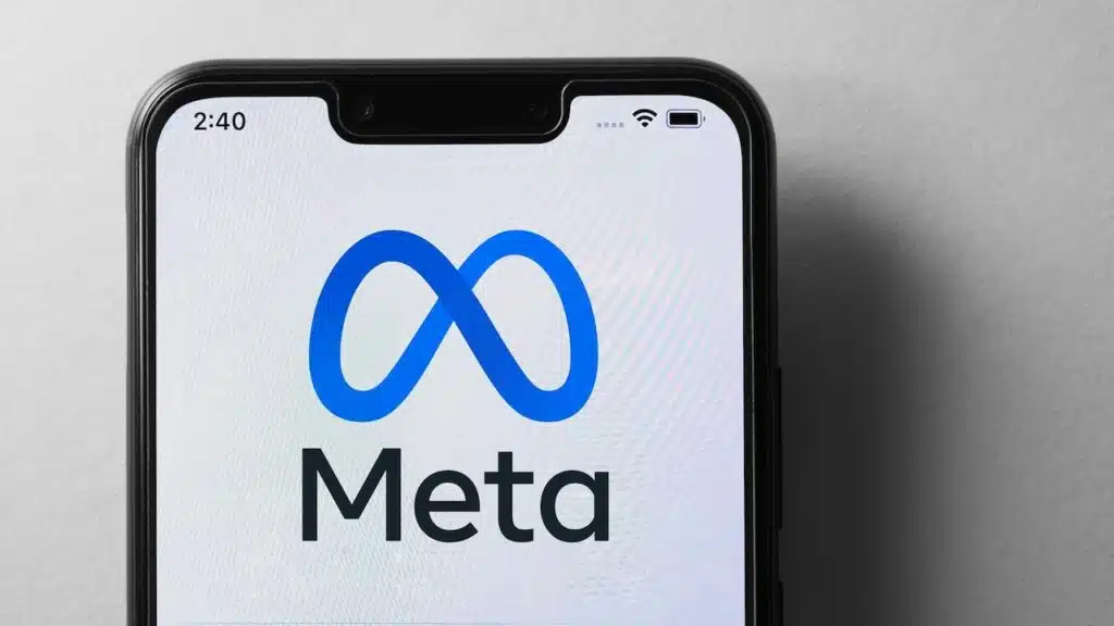 Close up of Meta logo on screen of mobile phone.