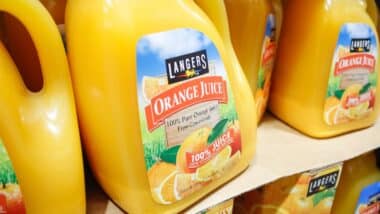 A view of several large containers of Langers Orange Juice, on display at a local big box grocery store.