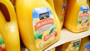 A view of several large containers of Langers Orange Juice, on display at a local big box grocery store.