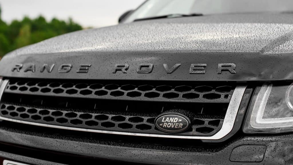 Range Rover Evoque in black colour. Completely black car with carbon lettering on the hood.