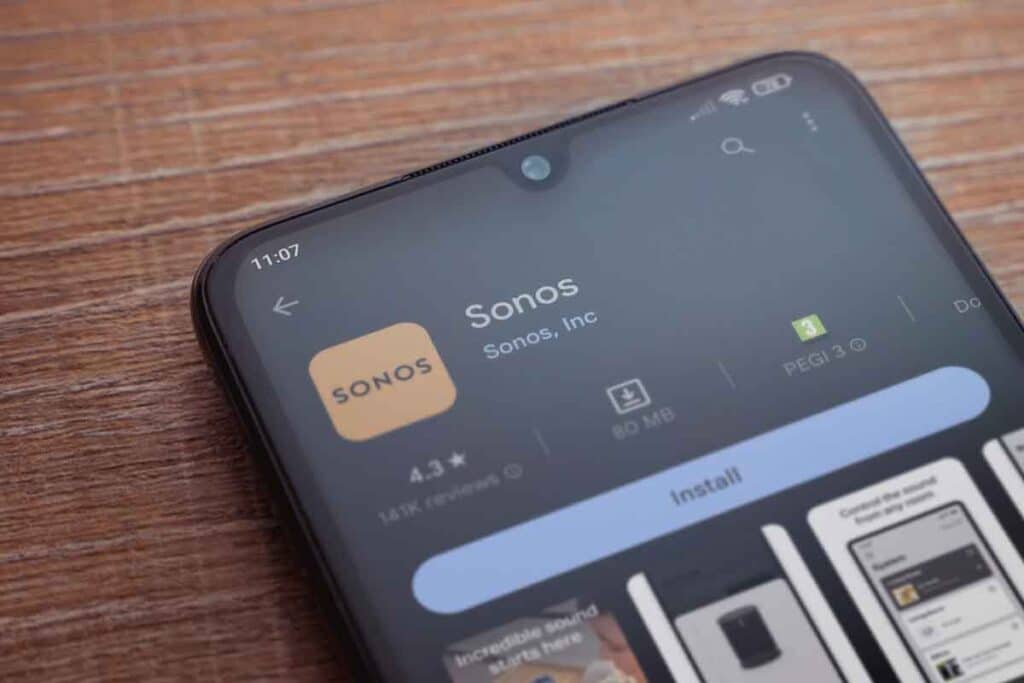 Close up of Sonos app download page displayed on a smartphone, representing the Sonos class action lawsuit.