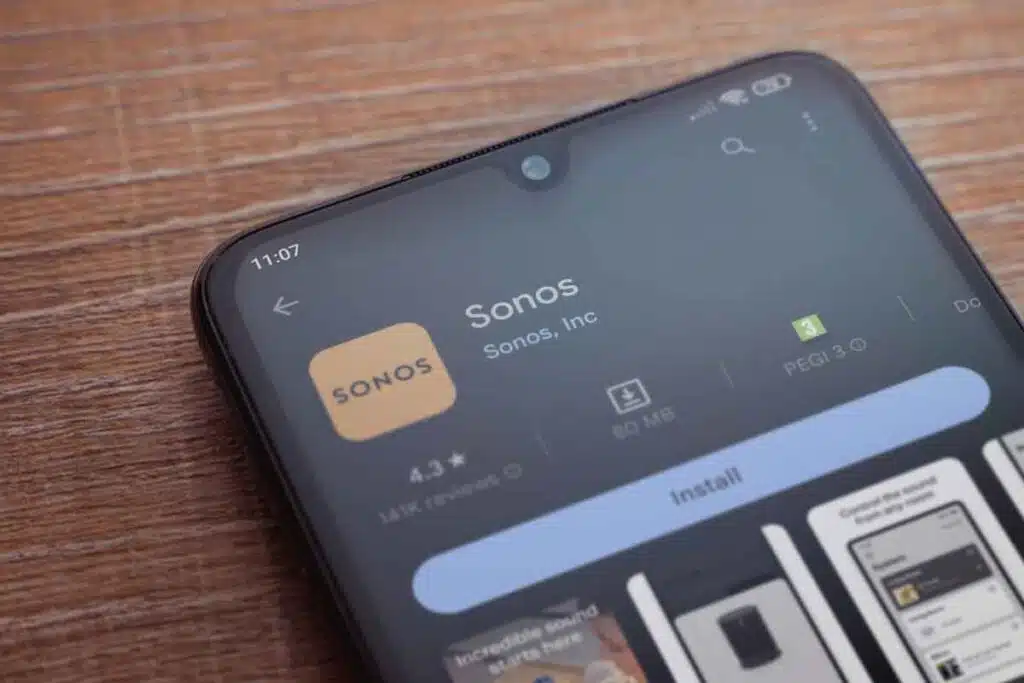 Close up of Sonos app download page displayed on a smartphone, representing the Sonos class action lawsuit.