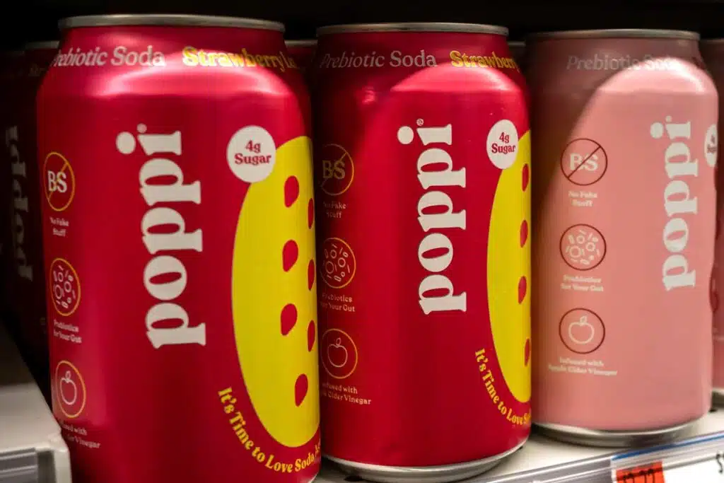 Close up of Poppi drinks on a supermarket shelf, representing Poppi settlement.