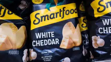 Close up of Smartfood White Cheddar popcorn on a supermarket shelf, representing Smartfoods class action.
