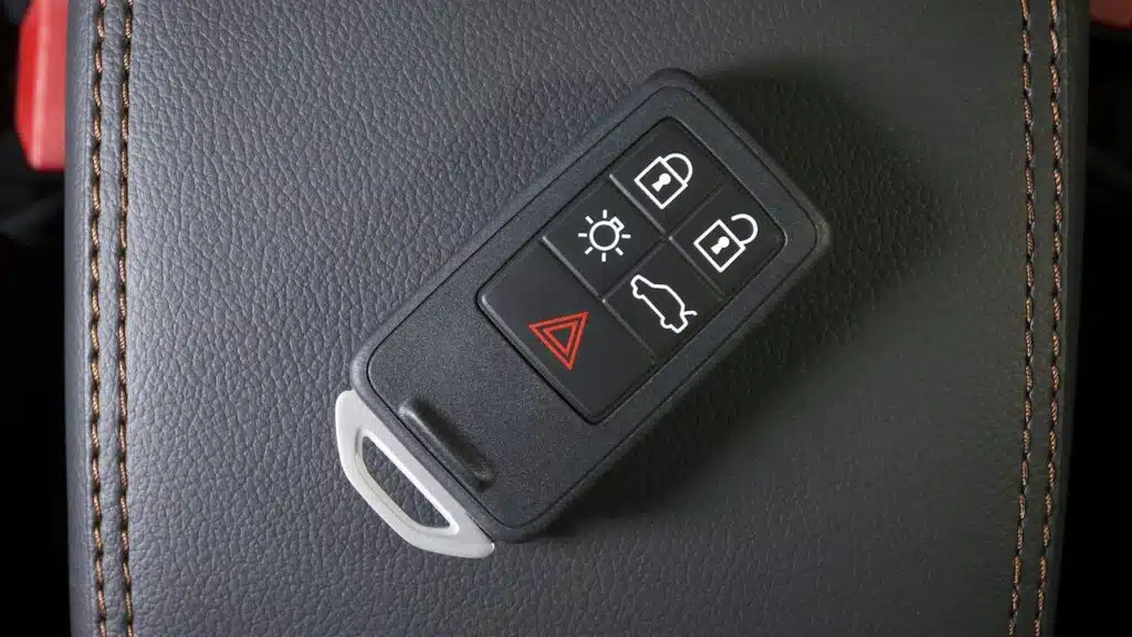 Wireless car key in modern car interior,