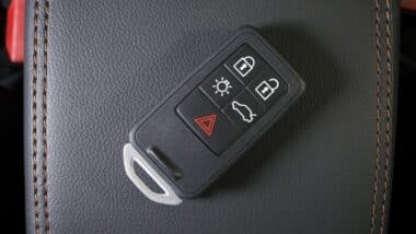 Wireless car key in modern car interior,