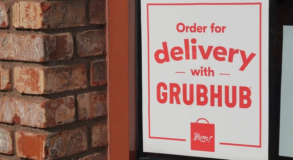Sign for Grubhub delivery on a restaurant window