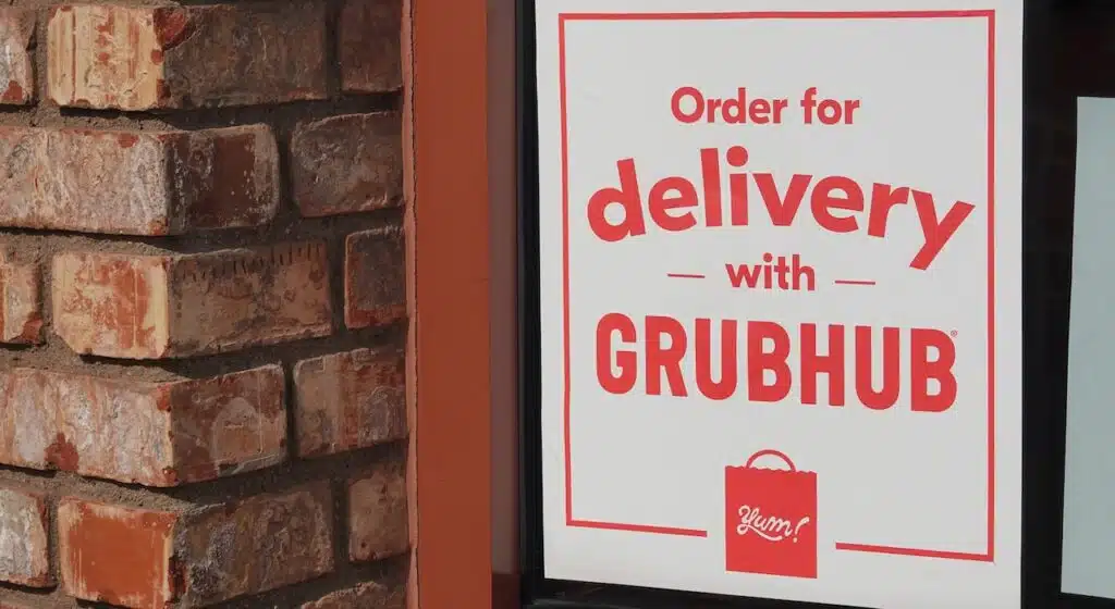 Sign for Grubhub delivery on a restaurant window