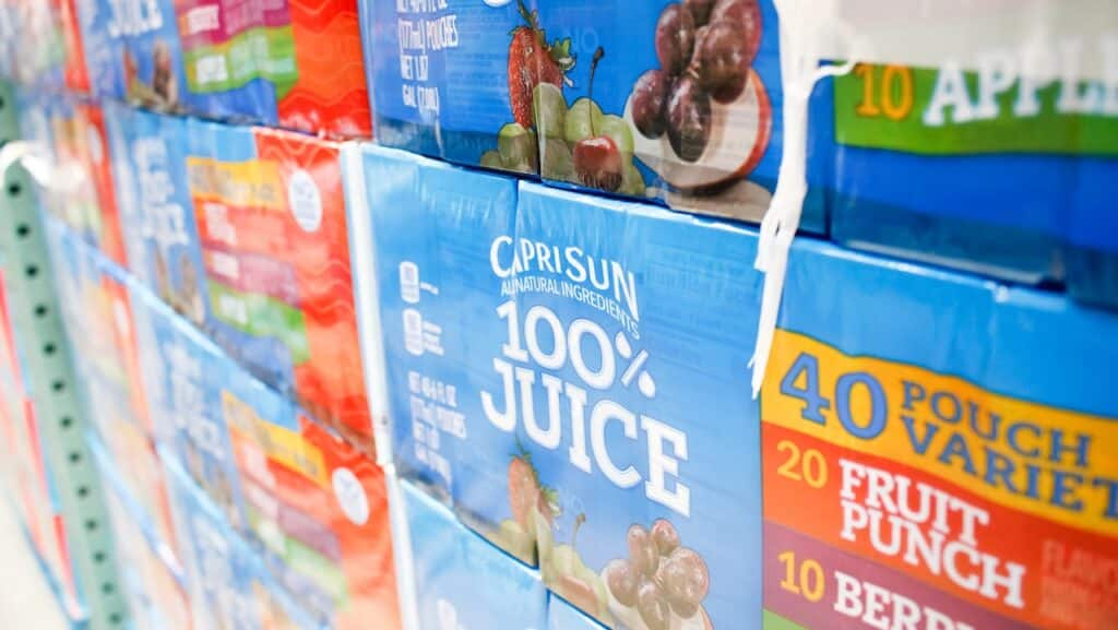 A closeup view of several cases of CapriSun juice pouches, on display at a local big box grocery store.