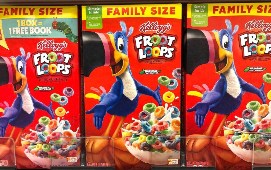 Grocery store shelf with boxes of Kellogg's brand cereal, Froot Loops.