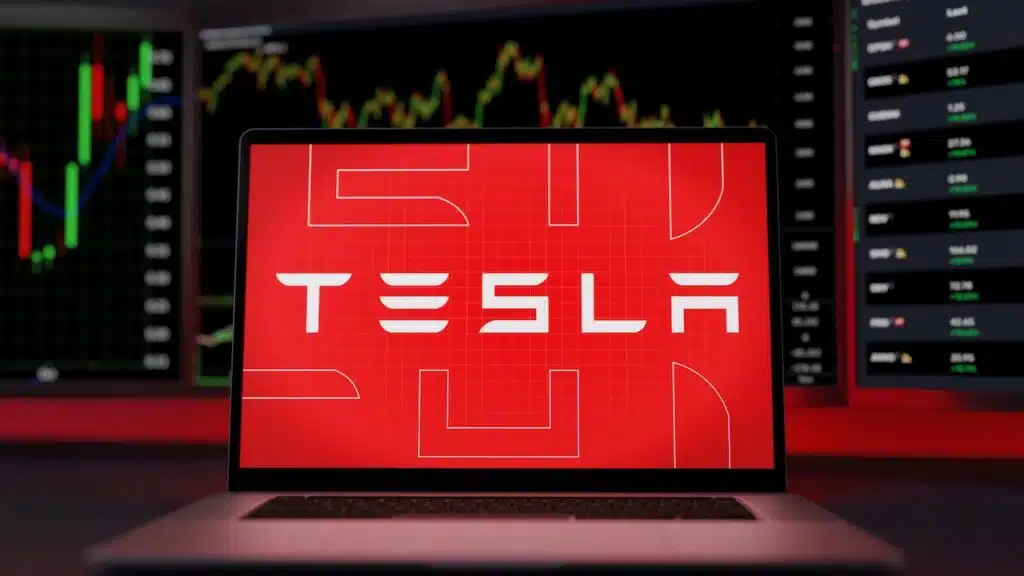Tesla logo on a laptop screen trading stock market