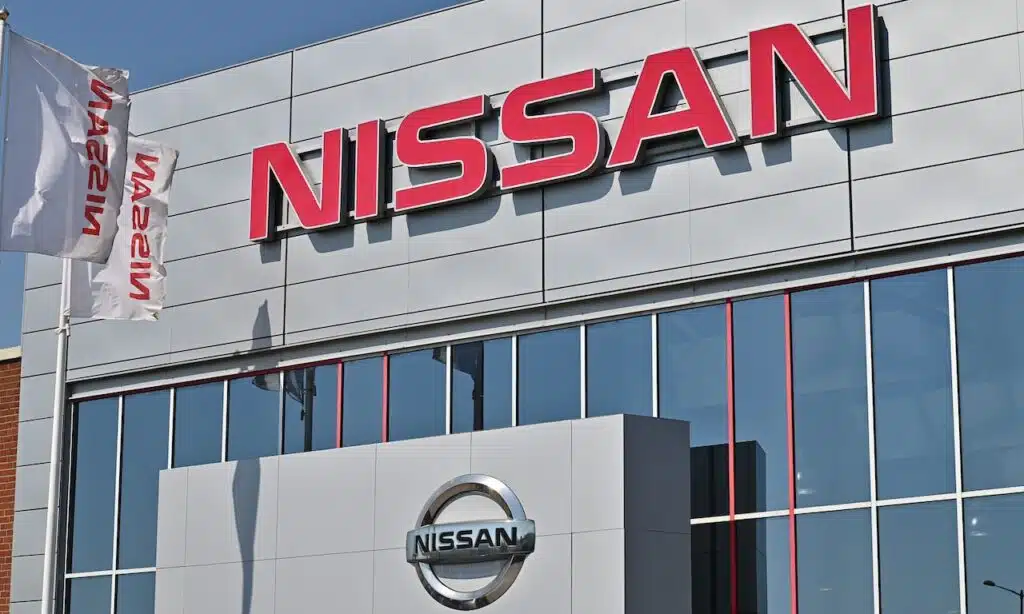 A wall sign for the Japanese car manufacturer Nissan at a dealership