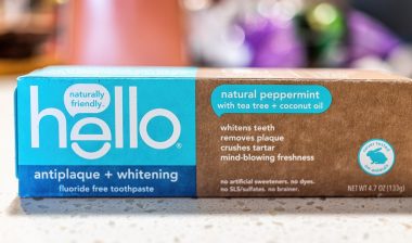 Macro closeup of Hello flouride free toothpaste package on table with sign text of product for antiplaque and whitening
