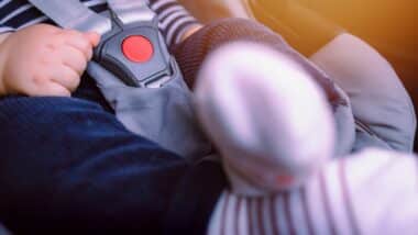 Close-up of baby sitting in car seat