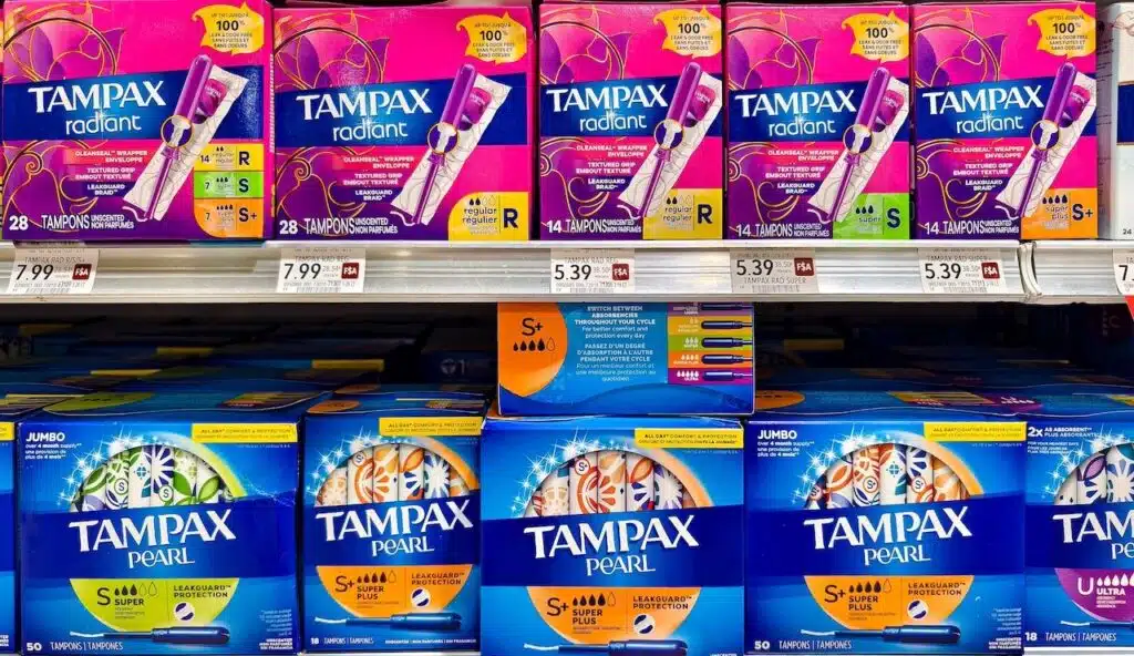 Various Tampax tampons on display in a supermarket aisle