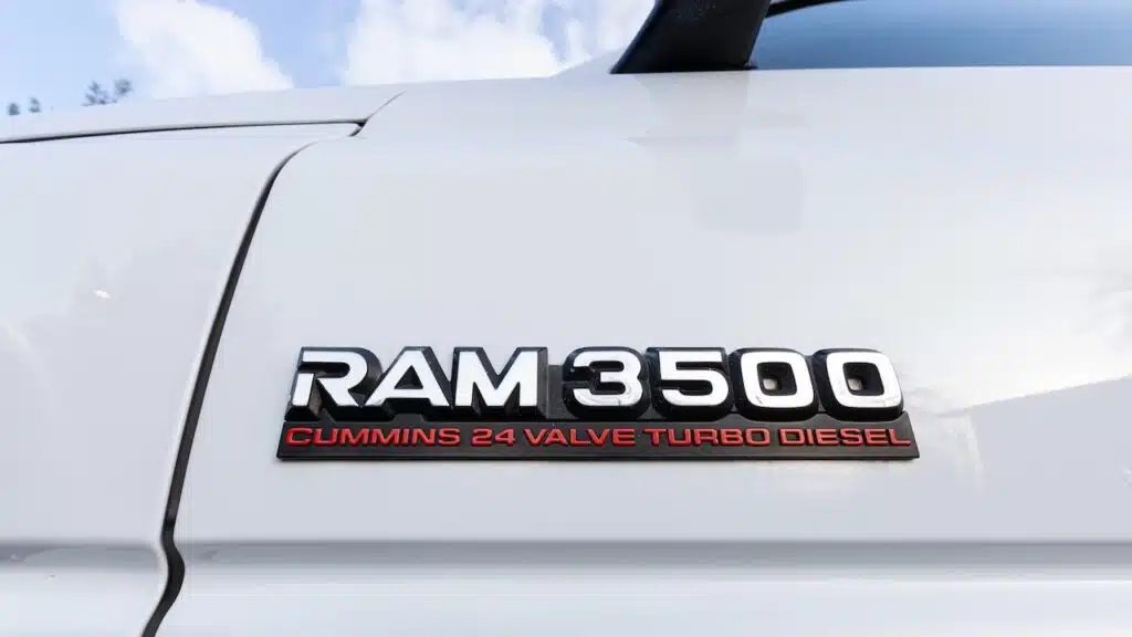 White Dodge Ram 3500 Cummins 24 Valve Turbo Diesel 4x4 off-road American pickup truck emblem logo