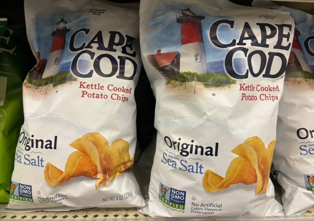 Bags of Cape Code Original sea salt flavored kettle cooked potato chips on display on a store shelf