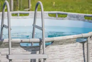 A peaceful aboveground pool complete with a ladder, inviting you to relax and enjoy fun activities outdoors