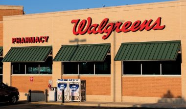 Exterior of a Walgreens pharmacy in the early morning sun