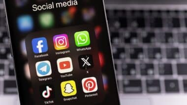 smartphone with mobile apps Facebook, Instagram, WhatsApp, Telegram, YouTube, Twitter X, TikTok, Pinterest.
