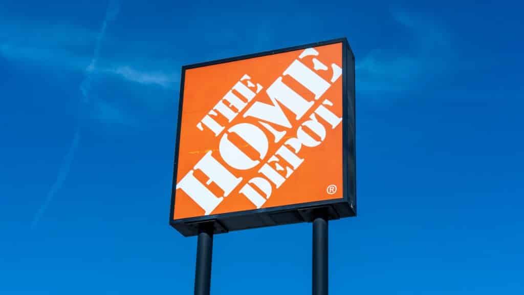 Close up of Home Depot logo sign with the blue sky background.