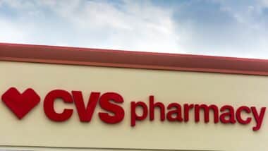 CVS Pharmacy store sign on a cloudy day